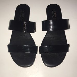 Black flat sandals.